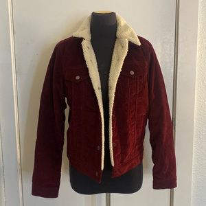 A maroon red corduroy Levi’s jacket with fur lining and collar!